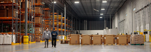 Warehouse associates walking through the 3PL facility