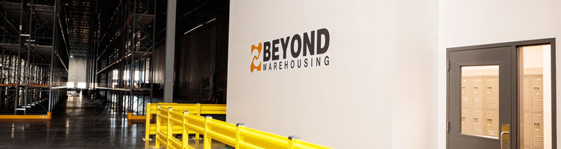 Inside the warehouse with logo on the wall