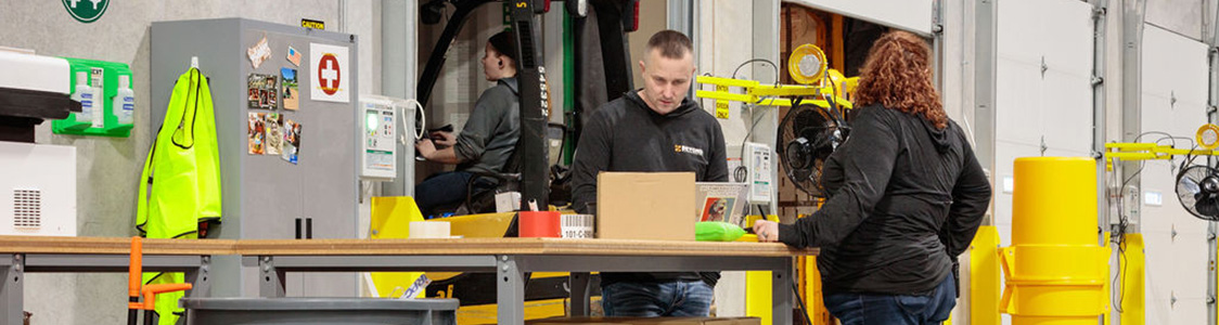 Employees working in the warehouse.