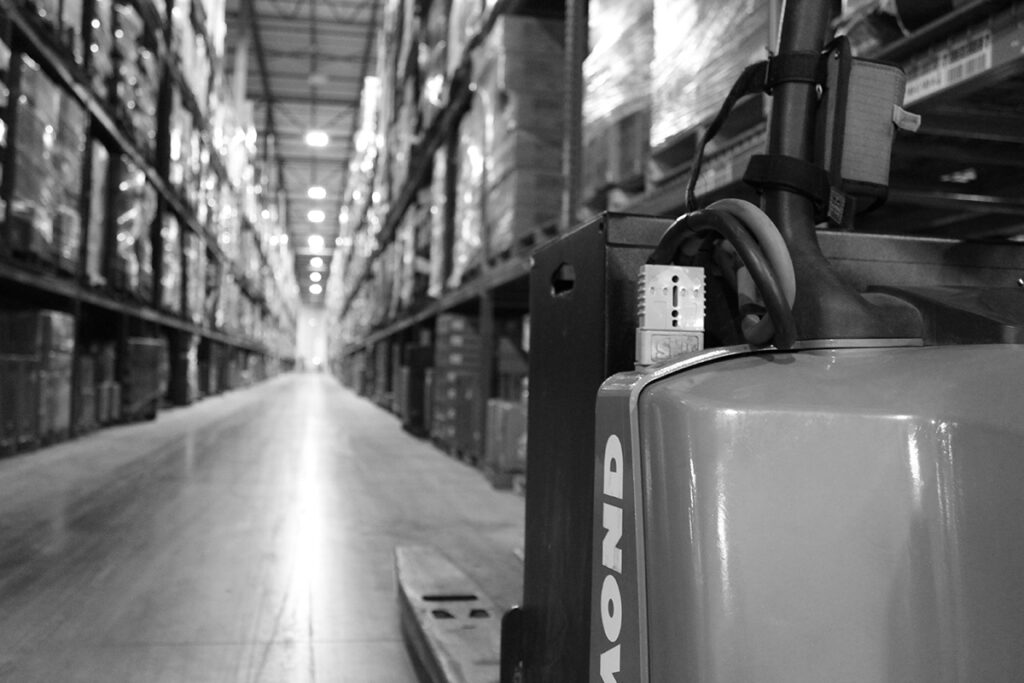 Forklift in Warehouse Aisle